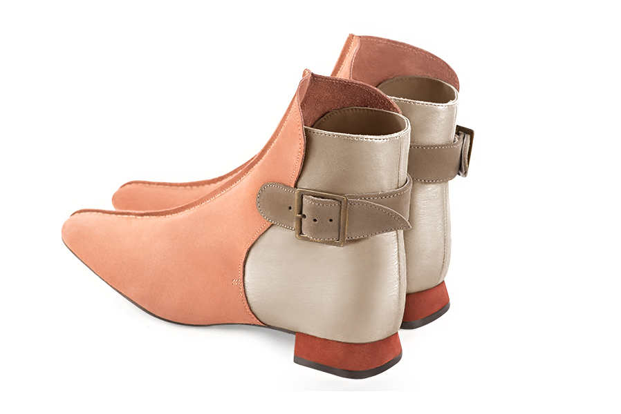 Peach orange, gold and tan beige women's ankle boots with buckles at the back. Square toe. Flat flare heels. Rear view - Florence KOOIJMAN